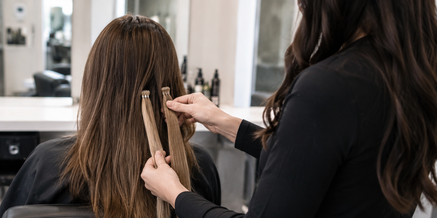 Client getting her first time hair extensions fitted at Hair Nova Finchley